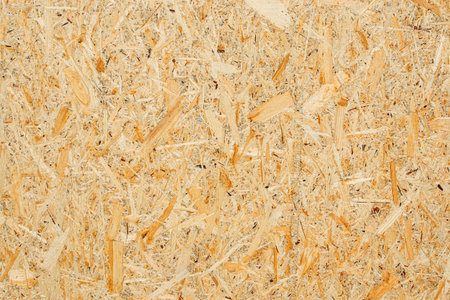 Chipboard texture background. Chipboard, particle board, engineered sheet wood made from small wood...