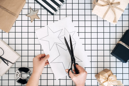 Creative gift wrapping ideas. Personalized gifts. Modern black and white flat lay with gift wrapping...