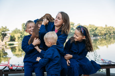 Large Family Parenting, Single Mom with large family. Single mum and three kids playing together...