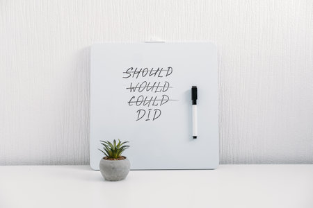 Should Would Could Did handwriting text quote on white board on table at home or office. Inspirational, Motivational, Positive quote for Girl Bossの写真素材