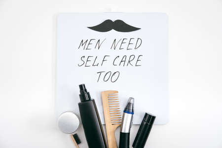 Men self care kit with male beauty care products and devices and letter board with text Men need self care too. Man self care set with skin and hair care products for boyfriend, husband fatherの写真素材