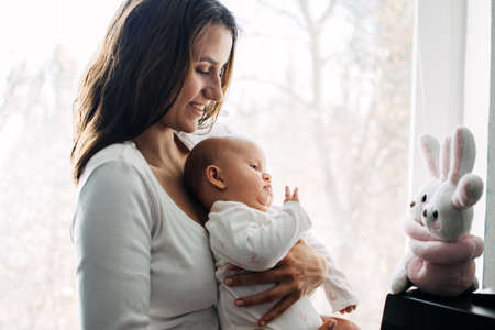 Mental Health in Postpartum Time. Maternal Mental Health. How to avoid pregnancy And Postpartum Disorders, postpartum baby blues, depression. Portrait of happy mother and newborn babyの写真素材