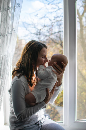 Mental Health in Postpartum Time. Maternal Mental Health. How to avoid pregnancy And Postpartum Disorders, postpartum baby blues, depression. Portrait of happy mother and newborn babyの写真素材