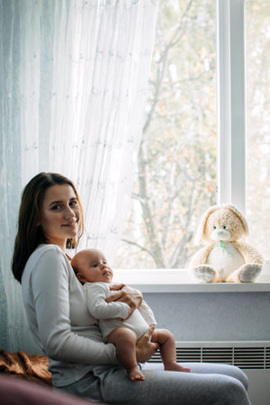 Mental Health in Postpartum Time. Maternal Mental Health. How to avoid pregnancy And Postpartum Disorders, postpartum baby blues, depression. Portrait of happy mother and newborn babyの写真素材