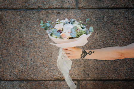 Edible Arrangements, Fruit Baskets, Bouquets, Gift Delivery. Female hands with Wonderful Edible Wedding Bridal Flower Bouquets. Custom DIY Fruit Vegetable green organic bouquet.の写真素材