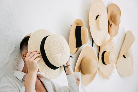 Home decor and interior design. Straw hats like interior decorate the walls in apartmentの写真素材