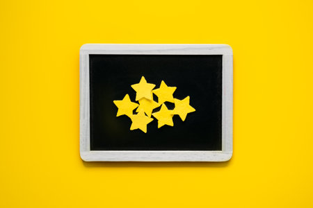 Customer Experience, Review Concept. Many yellow stars Negative Online Reviews rating in frame on yellow background. Customers Ratings and Reviewsの写真素材