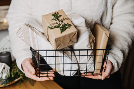 Christmas Zero waste eco friendly reuse wrapping gifts process. Woman wrapping Christmas Zero waste...