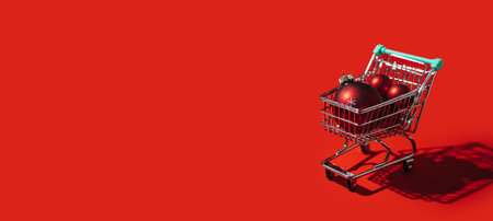 Christmas Shopping trolley cart with red xmas ornaments balls on red background. Minimal Christmas shopping sale web banner copy space concept.の写真素材