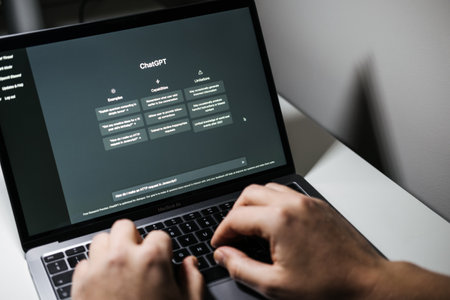 Screen with ChatGPT chat with AI or artificial intelligence. Man search for information using artificial intelligence chatbot developed by OpenAI. Warsaw, Poland - December 02, 2022のeditorial素材