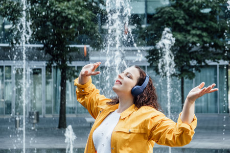 Outdoor portrait of Woman in headset in sound healing therapy. Healing Sounds and Sound Therapy. Sound vibrations for opening, clear, and balance chakras and energy.の写真素材