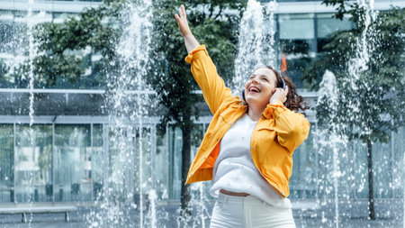 Plus size Wellbeing, Ways to Practice Body Positivity. focus on self-love and acceptance. Happy confident young woman dancing and celebrating her natural body outdoorsの写真素材
