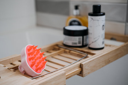 Shampoo Brush. Silicone Exfoliator Massager brush for circulation and follicle stimulation for optimal scalp health. Silicone Scrubber in the bathroomの写真素材