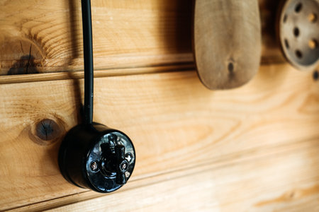 External electrical wiring in a wooden house. Safe Installation of electrical wiring inside a wooden house. Retro wiring in a wooden houseの写真素材