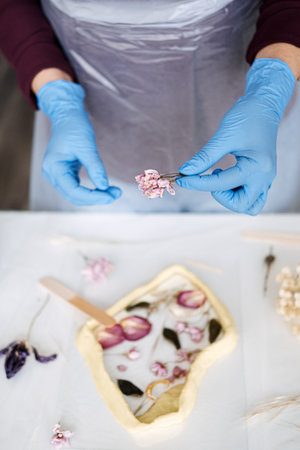 Epoxy Resin Art. Creating Art with Resin on workshop. The art process of creating epoxy resin handmade staff in art studio.の写真素材