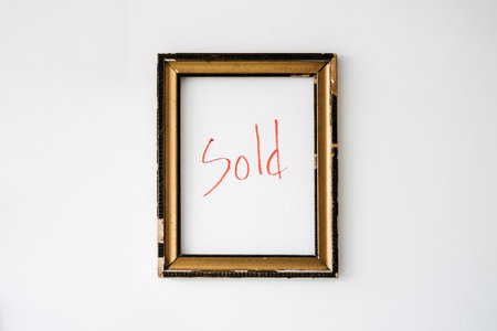 Empty picture frame with red text sold inside. Art Online, Buy Sell Original Art, Trading Paintings for Sale. Modern Contemporary Art for Sale in Online Auctionsの写真素材