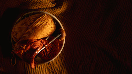 Autumn Fall Hobbies and Activities, knitting. Hygge Warm Hobbies to start a new cozy leisure-time activity. Fall cozy hobbies to help relax. Knitting needles and threads for knitting in sunlightの写真素材