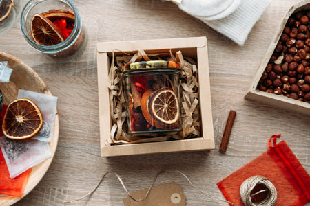 DIY Christmas gift ideas. Craft Cocktail Kits for Gifting in jars. Homemade Dry Holiday Potpourri with oranges, cinnamon sticks and spicesの写真素材