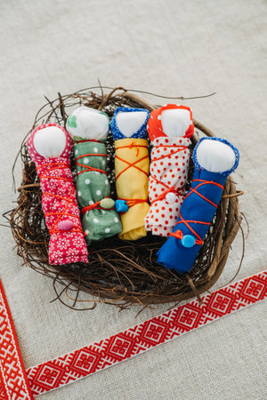 Handmade Motanka Dolls in a Nest for Good Luck. colorful handmade Motanka dolls, a traditional Slavic charm for luck and prosperity, with ethnic patterns.の写真素材
