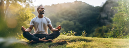 Masculine Meditation For Men. Latin-American Hispanic Man Meditating outdoors. Peaceful scene of man meditating on nature, moment of tranquility and mindfulnessの素材