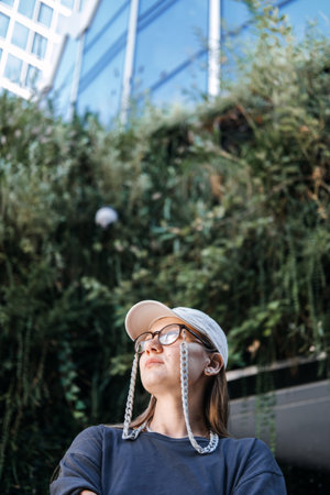 Young Woman Exploring Urban Greenery. Urban Nature and Environmentの写真素材