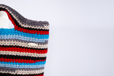 Colorful Handmade Crocheted Bag on White Backgroundの写真素材