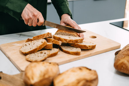 Artisan Sourdough Bread Preparation on Wooden Boardの写真素材