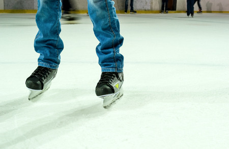 Men's legs in ice skatesの写真素材