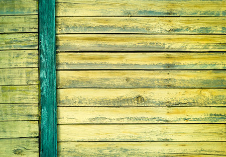 Green old painted cracked wooden door texture as background. Closeupの写真素材