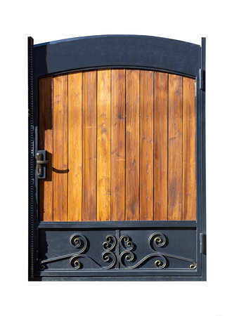 Old vintage wooden front door with metal elements isolated on white background