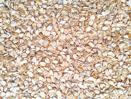 Oatmeal background. Healthy food. Flakes for breakfast.