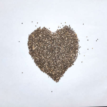 Heart from Chia seeds isolated on white background. Healthy superfoodの写真素材