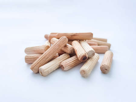 Wooden dowels for assembling furniture on white background. front view. selective focusの写真素材