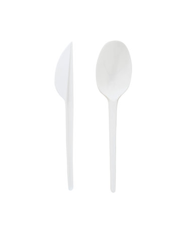 White plastic spoon and knife isolated on white background.の写真素材
