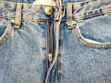Zipper on jeans. Jeans texture. Unzipped jeans.の写真素材