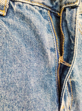 Zipper on jeans. Jeans texture. Unzipped jeans.の写真素材