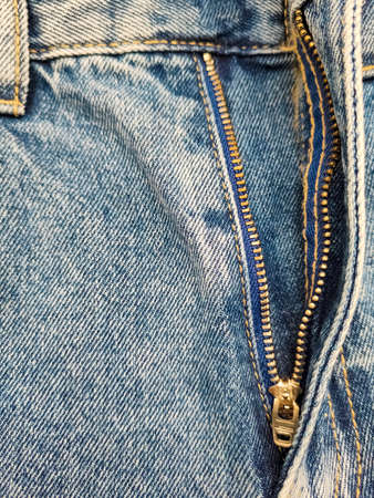 Zipper on jeans. Jeans texture. Unzipped jeans.の写真素材