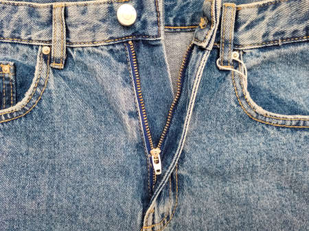 Zipper on jeans. Jeans texture. Unzipped jeans.の写真素材