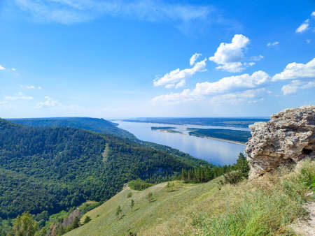 Beautiful landscape with moubtains, trees, the river Volga in Russia and blue cloudy sky in sunny dayの写真素材