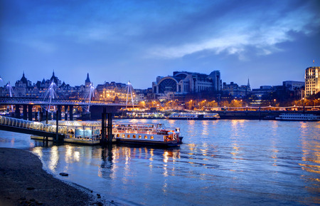 LONDON, UK - MARCH 29, 2014  South bank walk of the river Thames in twilight   View on bridge and modern architecture   HDR proceeding image のeditorial素材