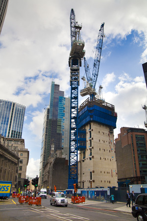 LONDON, UK - APRIL 24, 2014  Building site with cranes in the City of London one of the leading centres of global finance  のeditorial素材