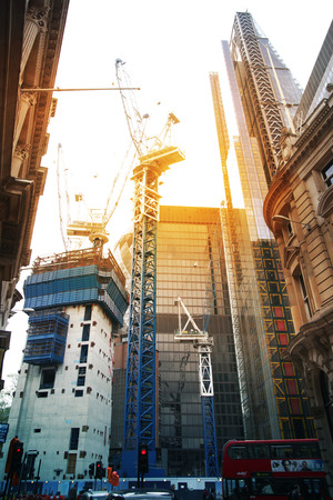 LONDON, UK - APRIL 24, 2014  Building site with cranes in the City of London one of the leading centres of global finance  のeditorial素材