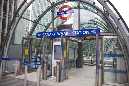 LONDON, CANARY WHARF UK - MAY 17, 2014  - Modern glass architecture of Canary Wharf business aria, tube undeground  entranceのeditorial素材