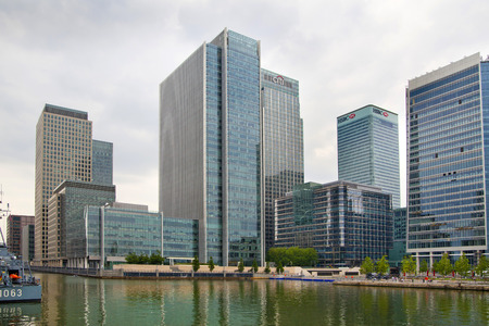 LONDON, CANARY WHARF UK - MAY 17, 2014  - Modern glass architecture of Canary Wharf business aria, headquarters for banks, insurance, media and other world known companies のeditorial素材