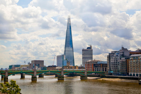 LONDON, UK - JUNE 30, 2014  Shard of glass on the river Thames, office and residential building in the City of London one of the leading centres of global finance のeditorial素材