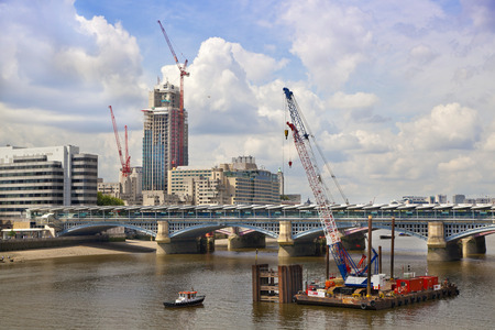 LONDON, UK - JULY 03, 2014  Building site with cranes , view from the bridge のeditorial素材