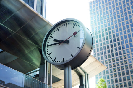 LONDON, UK - JULY 03, 2014  Clock Canary Wharf, morning hoursのeditorial素材