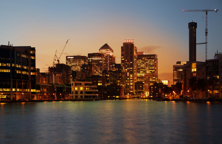 LONDON, UK - JULY 29 2014  Canary Wharf business district in dusk