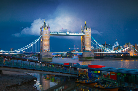 LONDON, UK - AUGUST 11, 2014: Tower bridge on the river Thames in night lightsのeditorial素材