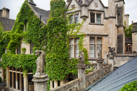 CHIPPENHAM, UK - AUGUST 9, 2014: Castle Combe, luxury house and gardens turned to be a hotel and golf clubのeditorial素材